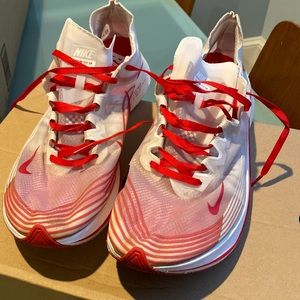 Nike red and white running shoes